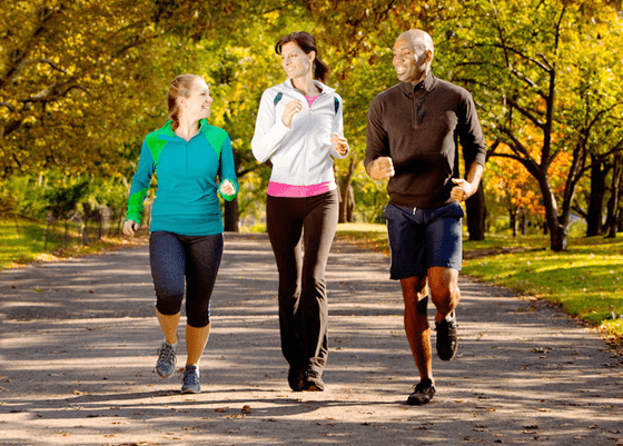 Three people jogging