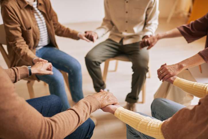 Group of people holding hands