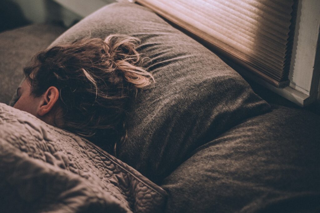 Person sleeping peacefully — sleep and addiction recovery in San Diego