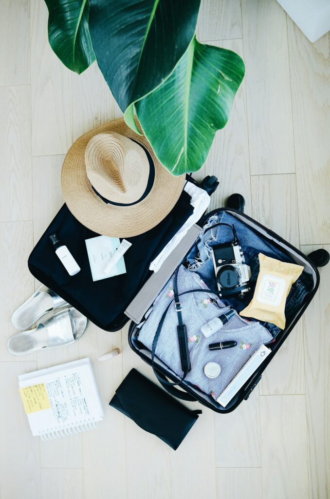 packing for what to pack for residential addiction treatment in san diego with neatly folded clothes and a suitcase