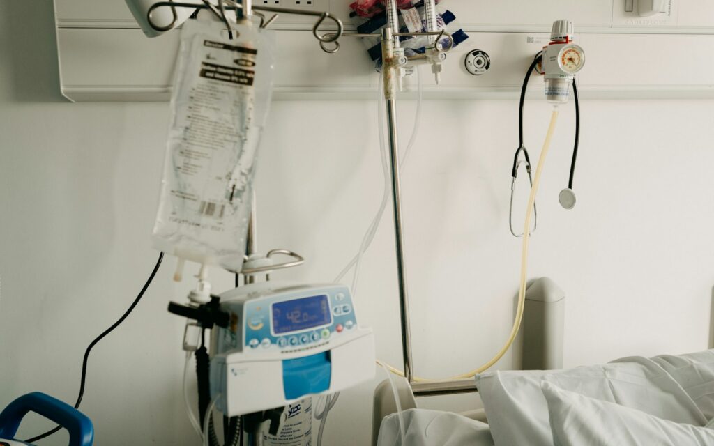 a hospital room with a bed and medical equipment